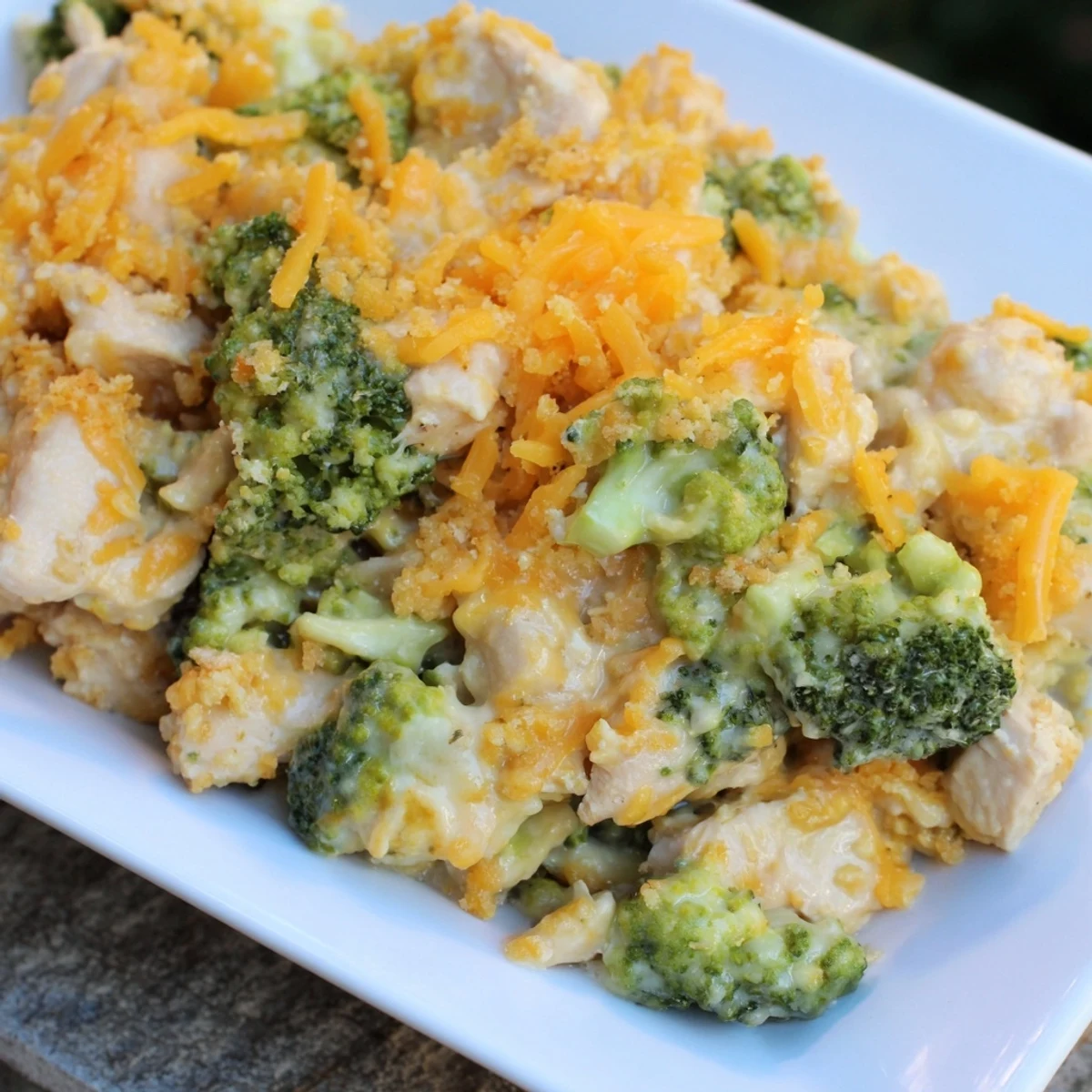 Golden-brown crust on top of a savory Chicken & Broccoli Cheddar Bake, ready to serve and enjoy.