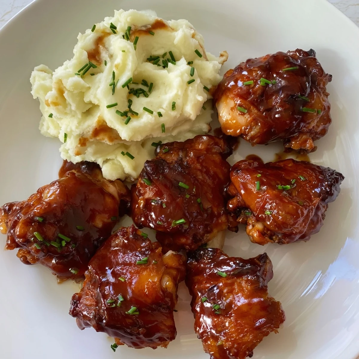 Golden, glazed honey BBQ chicken thighs, contrasted beautifully with fluffy, garlic mashed potatoes.