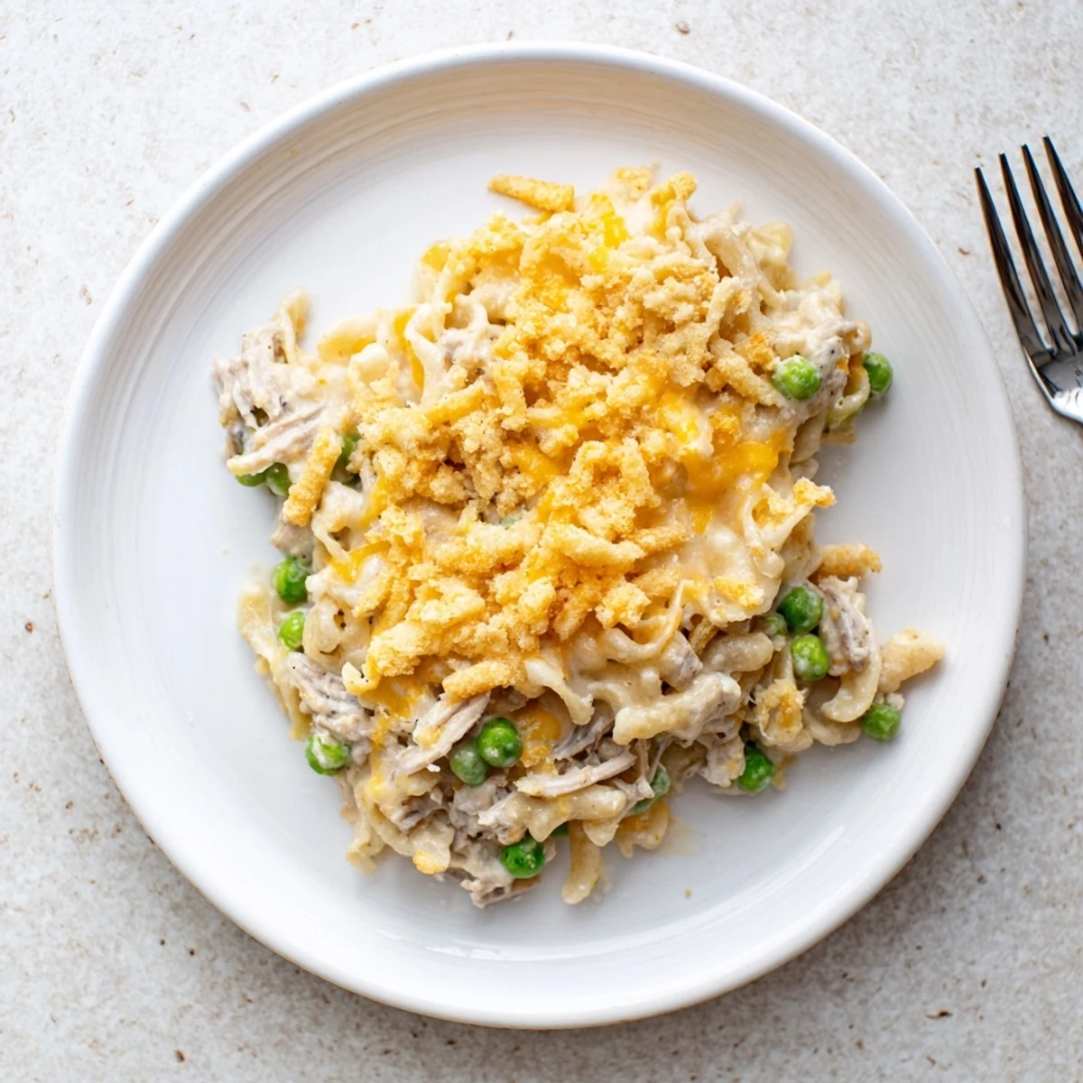Golden-brown Creamy Tuna Noodle Casserole with a bubbly, creamy filling and crunchy Ritz topping.