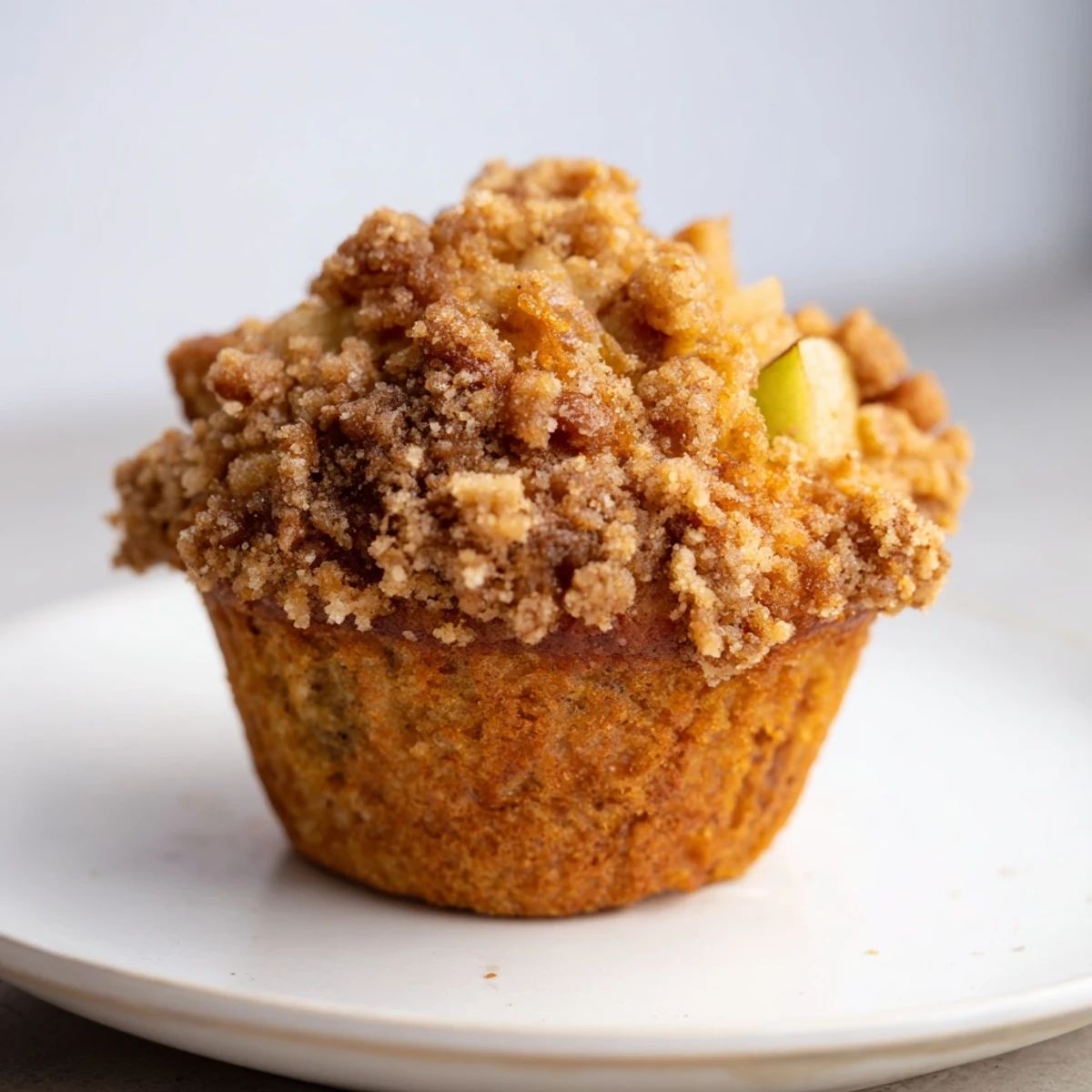 Freshly baked apple muffins, showcasing a close-up of the delicious crumb and apple chunks.