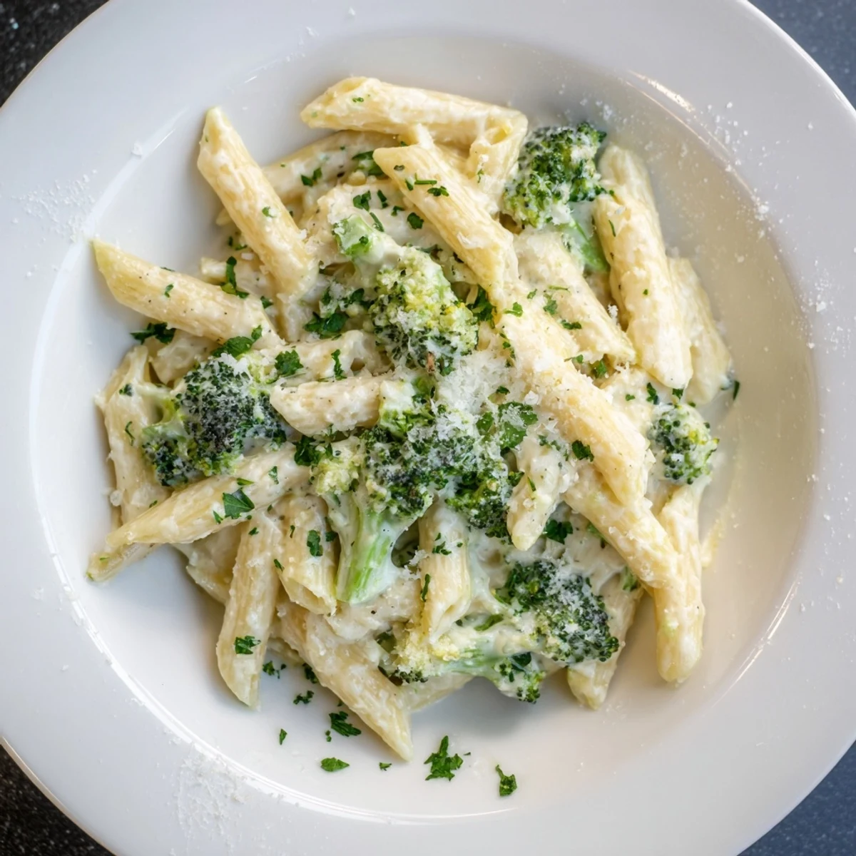 Tender pasta and broccoli coated in a delicious, creamy Cream Cheese Garlic Pasta, ready to serve warm.