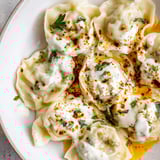 A beautiful close-up of golden-brown Turkish cheesy manti, ready to be enjoyed with flavorful toppings.
