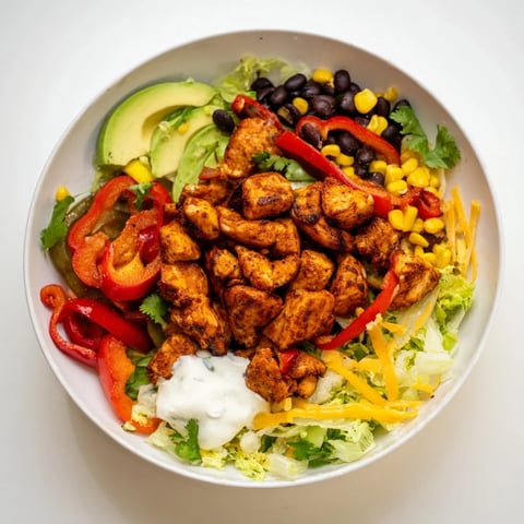 Sheet Pan Chicken Burrito Bowls, brimming with colorful roasted vegetables and seasoned chicken.