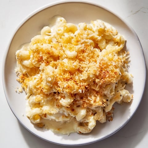 Golden-brown baked macaroni and cheese bubbling, a classic American comfort food ready to serve.