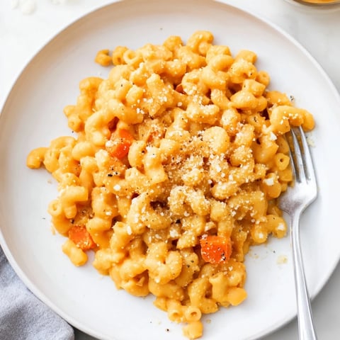 Golden cheesy One-Pot Butternut Squash Mac & Cheese, bubbling in a pot, ready to serve!