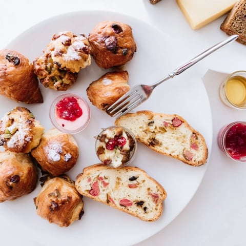 A beautifully presented Christmas Brunch Gift Box 2025 overflowing with festive baked goods and savory delights.