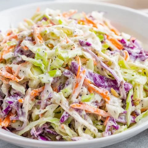 A vibrant bowl displays the refreshing Quick Coleslaw Salad, ready to serve as a side.