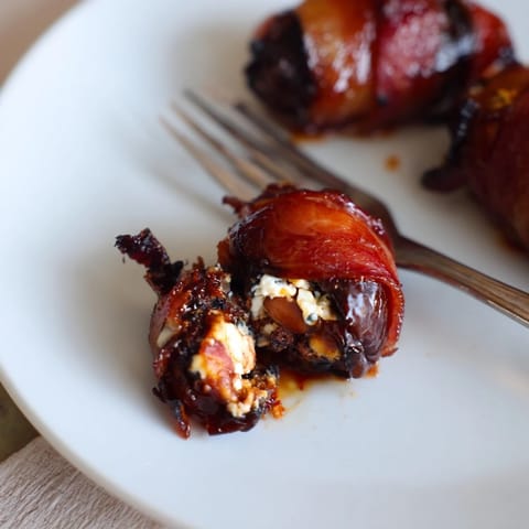 Crispy bacon encases creamy goat cheese and crunchy almonds in each date.  