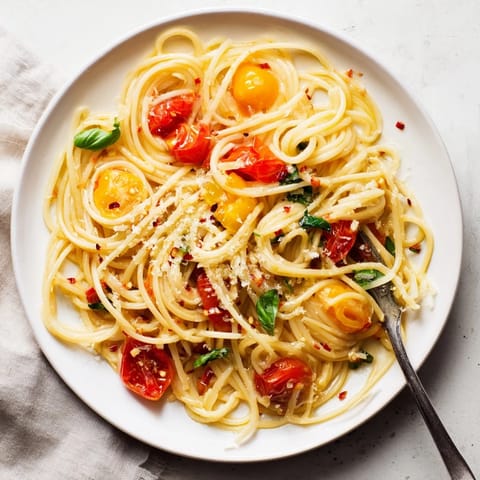 Tempting view of al dente Lazy-Girl Pasta tossed in a flavorful tomato and garlic sauce, ready to serve.