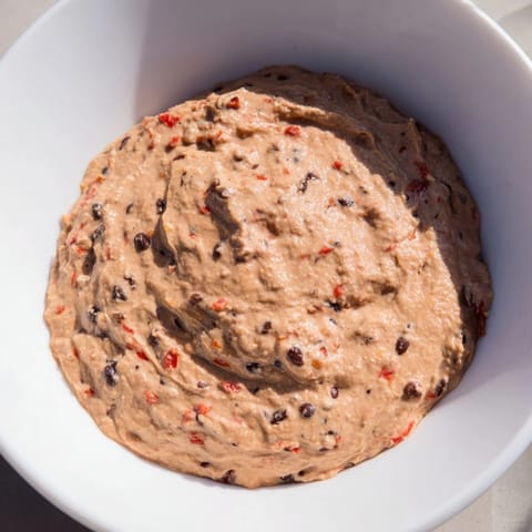 Creamy Spicy Black Bean Dip showcased with a swirl, ideal for a game day spread or party.