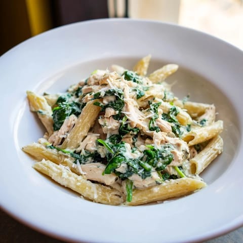 Tender turkey and vibrant spinach shine in this one-pot creamy Christmas pasta dish.