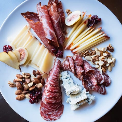 A beautifully arranged Majestic Venison Charcuterie Platter showcasing savory venison alongside cheeses, nuts, and jams.
