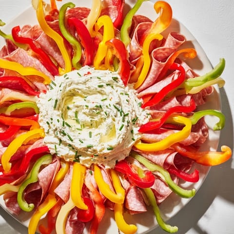Appetizing close-up of The Medusa Curls: Rolled meats and colorful vegetables offer a delicious, striking appetizer.