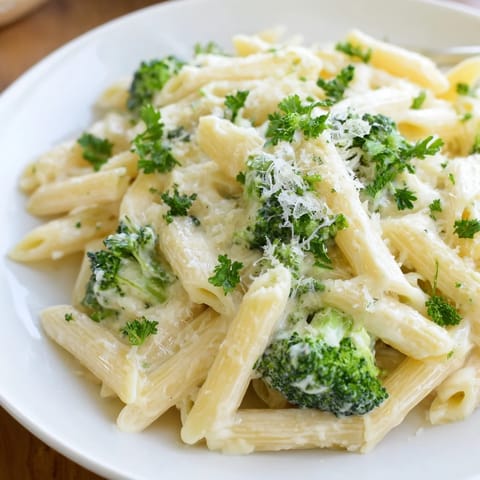 Rich and garlicky Cream Cheese Pasta, tossed with broccoli, promises a comforting homemade dinner experience.