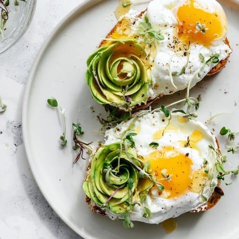 Breakfast is served: cloud toast 2.0 with creamy avocado and fresh microgreens toppings.