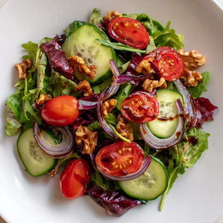 Enjoy a refreshing Quick Balsamic Vinegar Salad, tossed with a rich, tangy balsamic glaze, ideal as a starter.