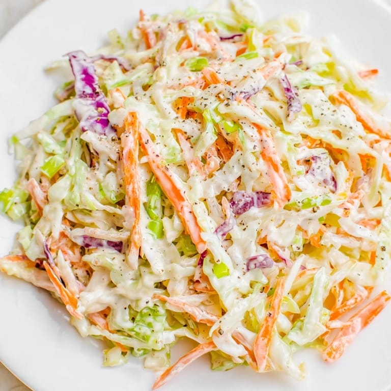 Freshly prepared Quick Coleslaw Salad, with colorful cabbage, is perfect for sandwiches, with a tangy bite.
