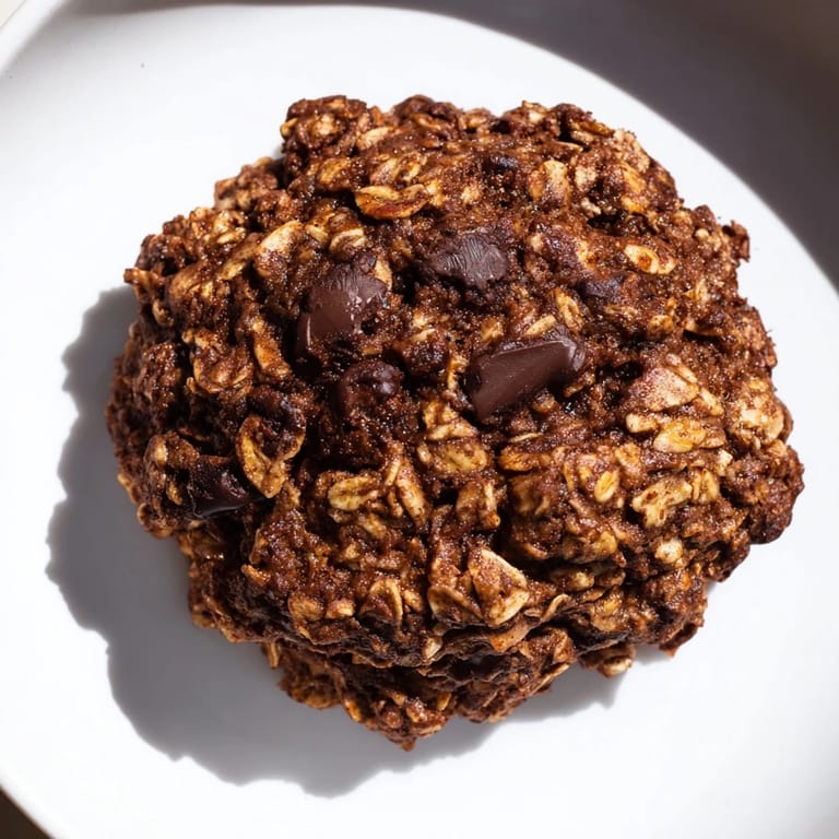 A stack of delicious Chocolate Oatmeal Breakfast Cookies, featuring a soft texture and rich cocoa aroma, perfect treat.