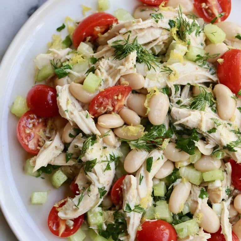 Juicy chicken, fluffy white beans, and diced red onion tossed in a tangy lemon dressing create a refreshing Mediterranean-inspired main dish.