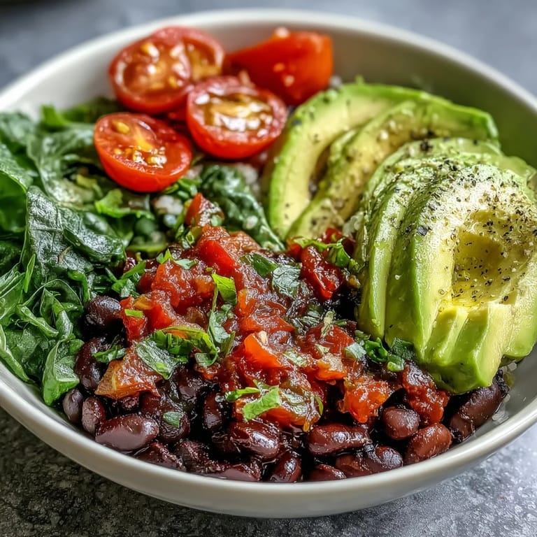 Hearty Plant-Based Taco Bowl with black beans, corn, and chunky avocado salsa.