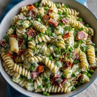 Hawaiian pasta salad with ham, pineapple, and ranch in a creamy, tropical dressing.