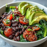 Vibrant Plant-Based Taco Bowl piled high with seasoned black beans and fresh toppings.